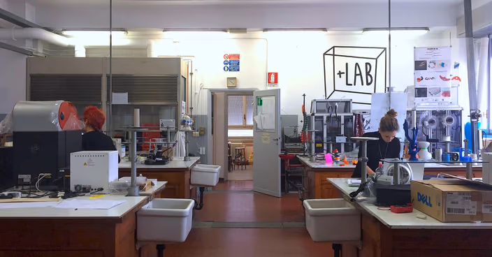 +LAB workspace at Politecnico di Milano with 3D printers and research equipment