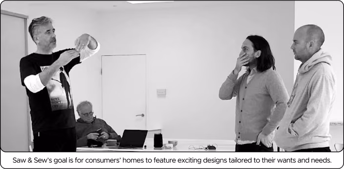 Winston Ferguson and his team collaborating during a design discussion or presentation.