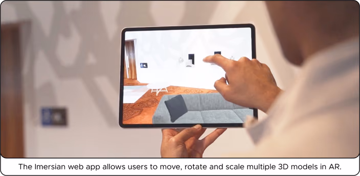 Tablet displaying augmented reality furniture in a room that can be manipulated and scaled by user interaction.
